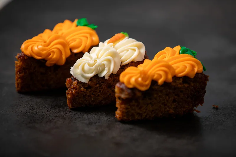 Cupcakes decorated with orange and white frosting