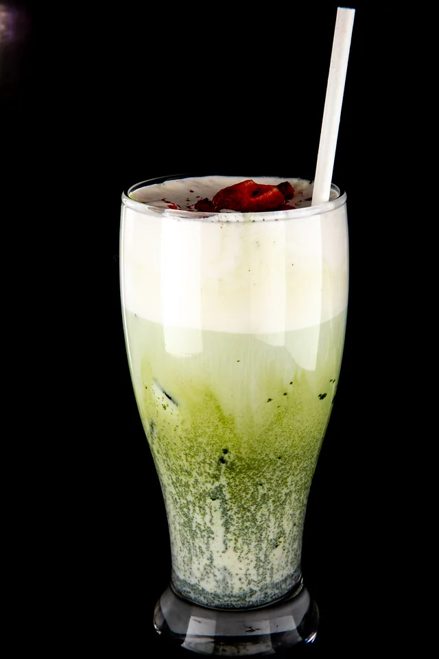 Green iced café drink in a clear cup
