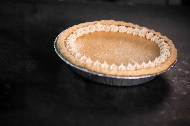 Round tart with a golden fluted crust