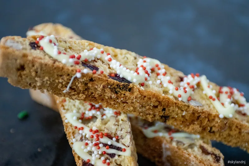 Chocolate-dipped biscotti decorated with colorful sprinkles